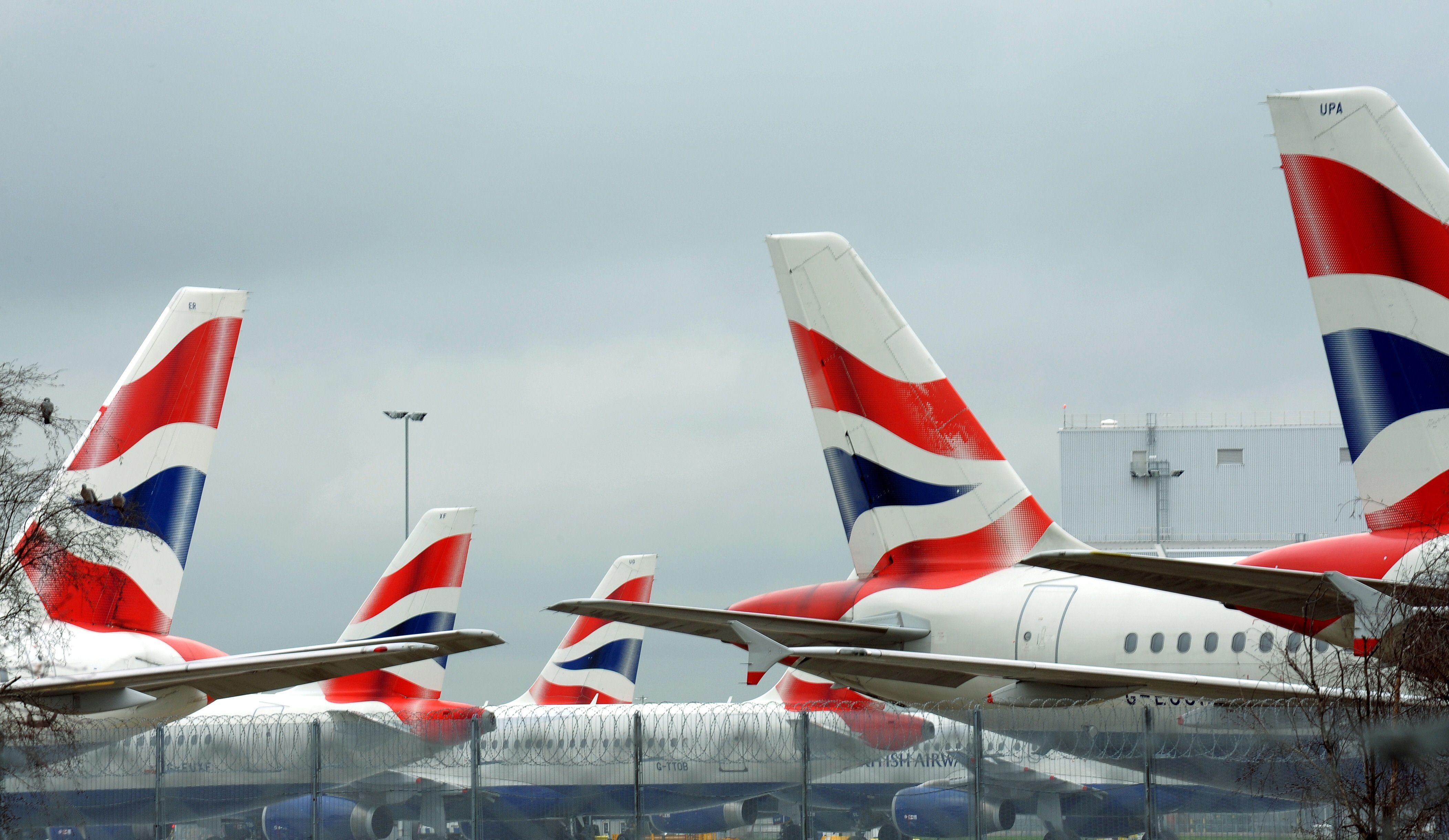 British Airways aircraft sit parked at London Heathrow Airport during