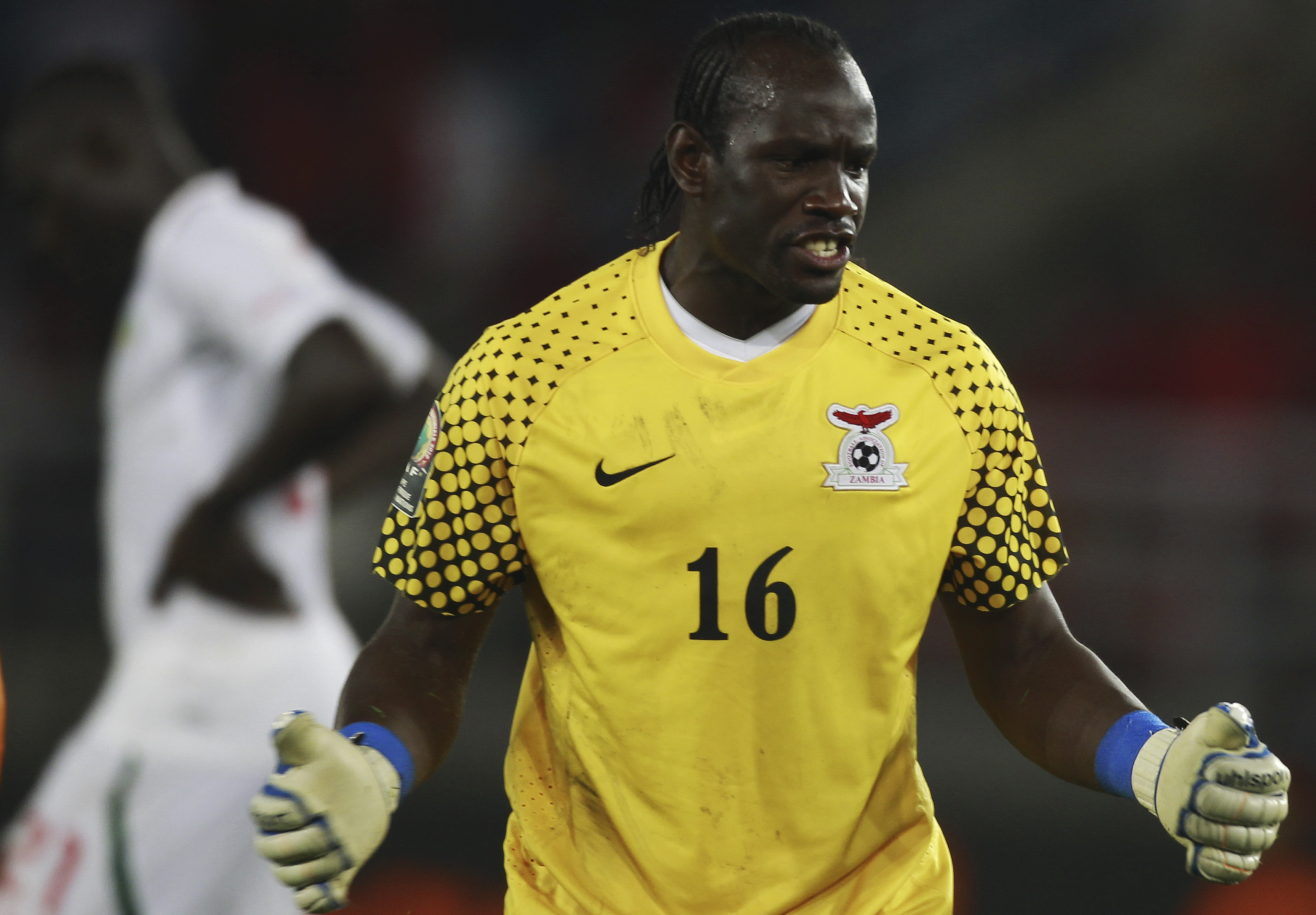 Zambia's goalkeeper Kennedy Mweene celebrates after his team won their African Nations Cup soccer match against Senegal in Bata