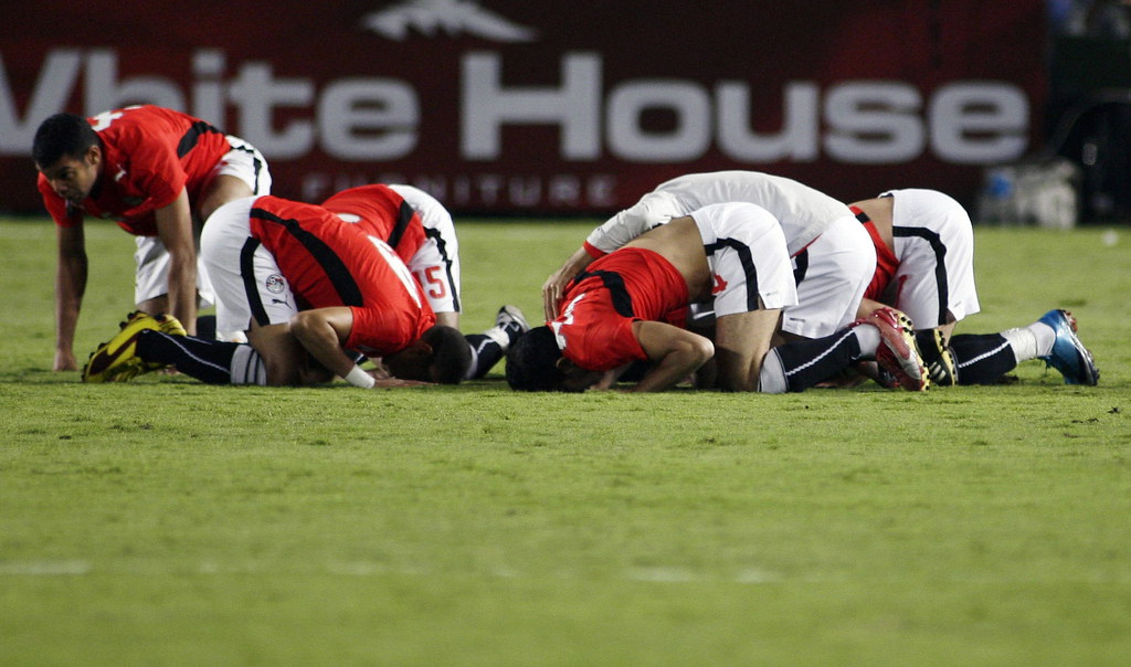 Egypt's players celebrate after Amr Zaki scored a goal against Algeria at Cairo Stadium