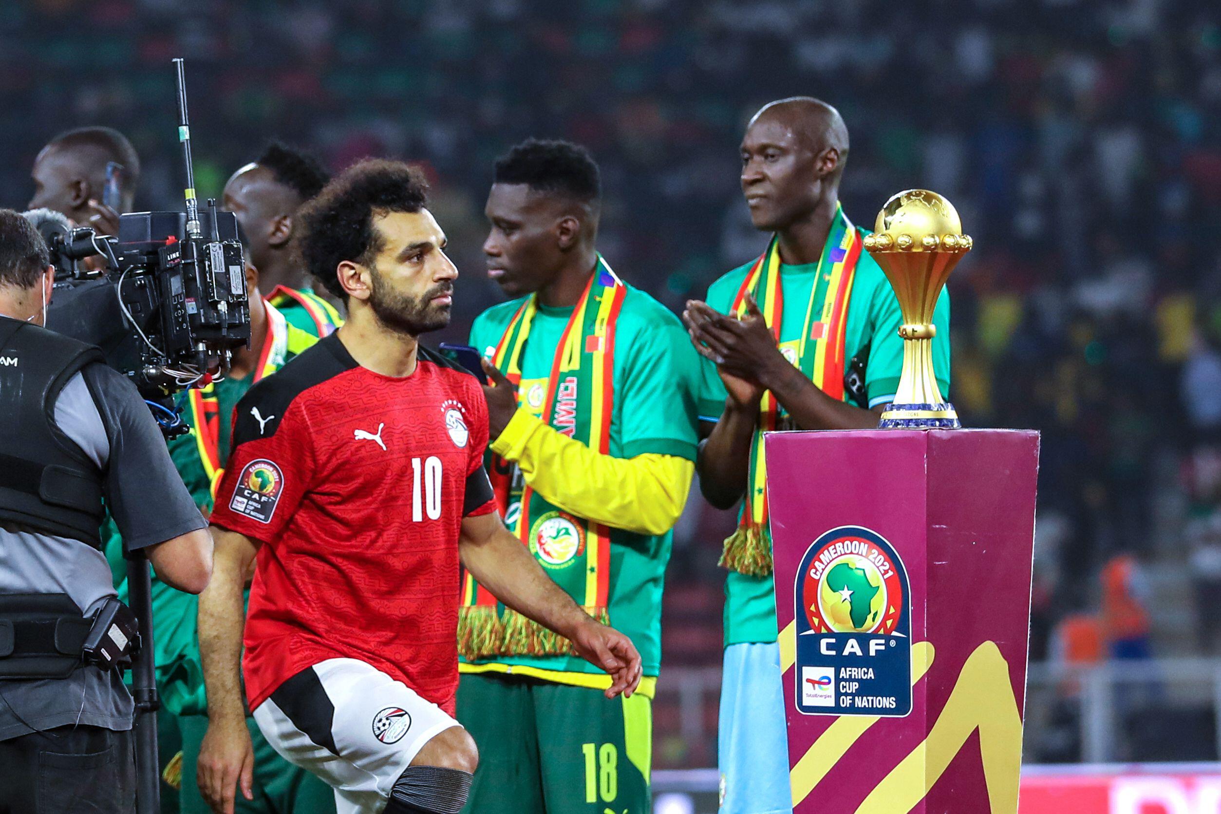 (10) Mohamed Salah (C) and team Egypt action before receives his silver medal from Patrice Motsepe, President of the Confederation of African Football (CAF) after the 2021 Africa Cup of Nations final soccer match between Senegal and Egypt at the Paul Biya