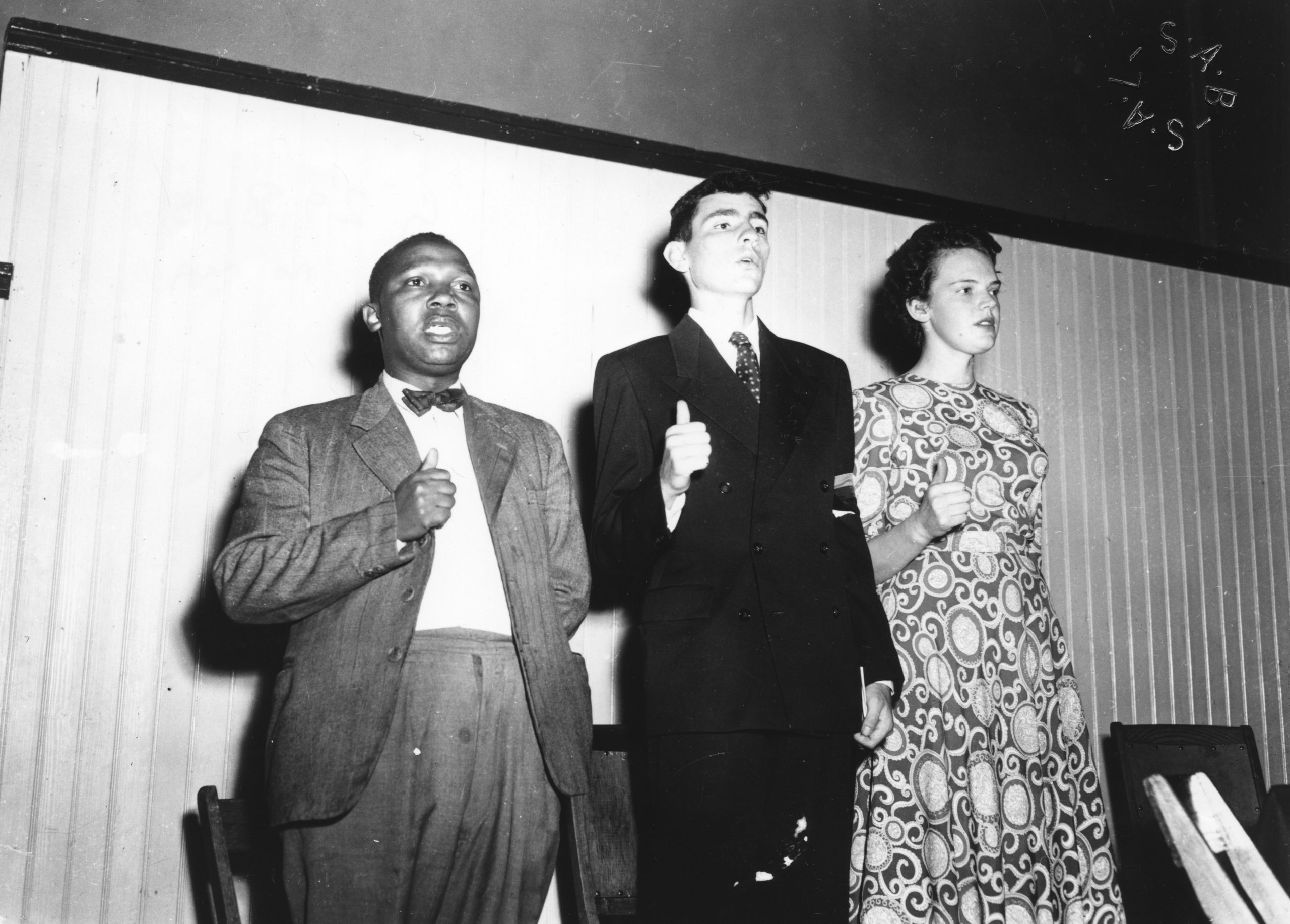Joseph Nkatlo, Albie Sachs and Mary Butcher giving the closed fists with upraised thumb salute at a Defiance Campaign meeting at the Drill Hall in Cape Town on 12 April 1952. Photo: National Library of South Africa. All images courtesy of Albie Sachs. 