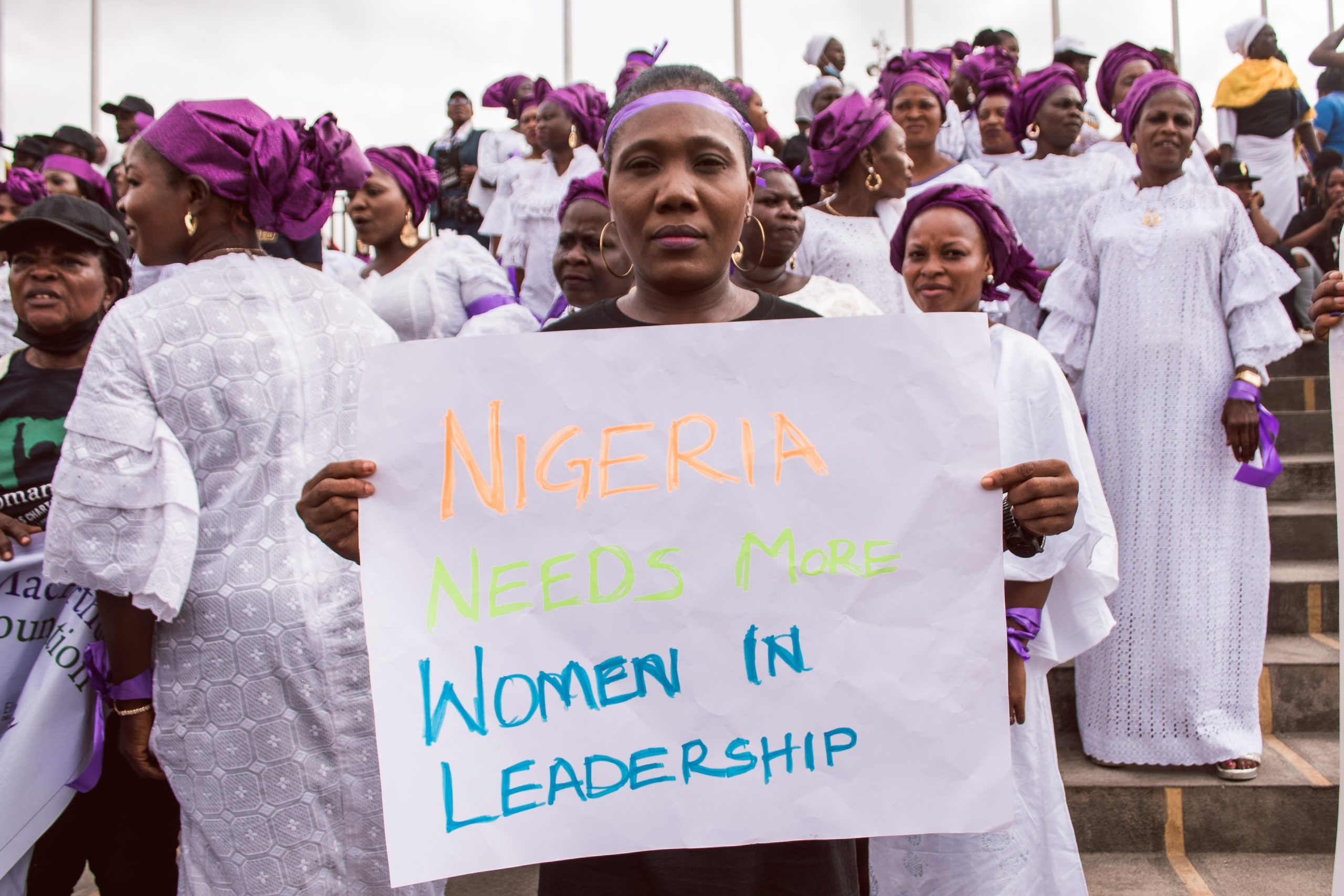 A,Woman,Holds,Up,A,Cardboard,That,Reads,-,Nigeria