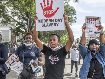 Protestors carry anti-IMF sign in Nakuru, Kenya.