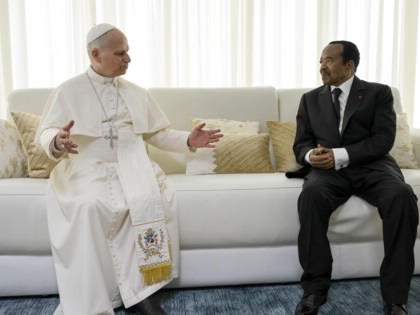 Pope Leo XIV and Paul Biya on a couch.