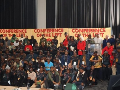 A group of conference delegates gathered for a photo.