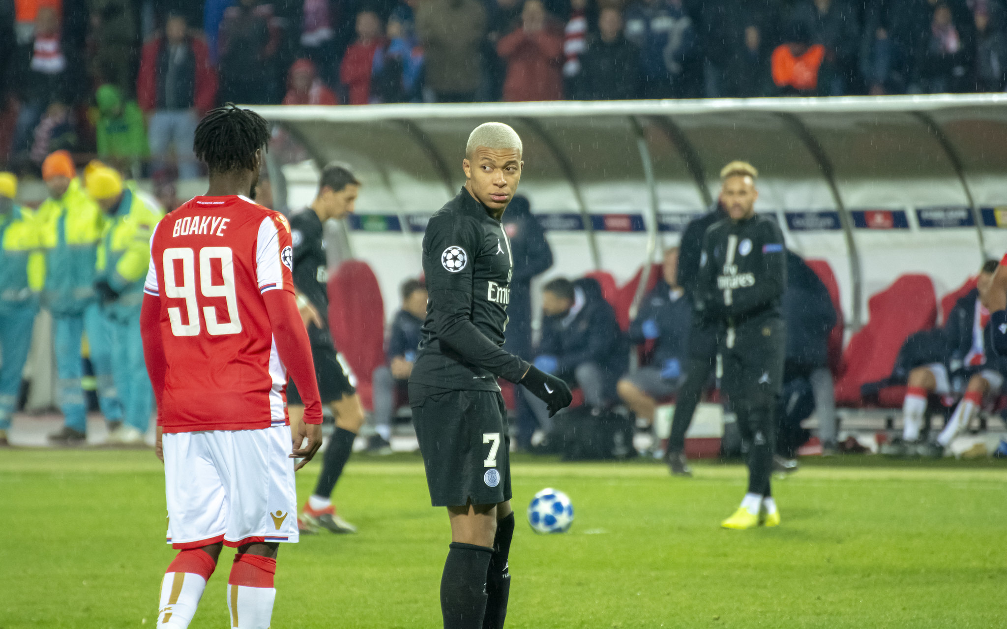 Kylian Mbappe looking at an opponent on the field.