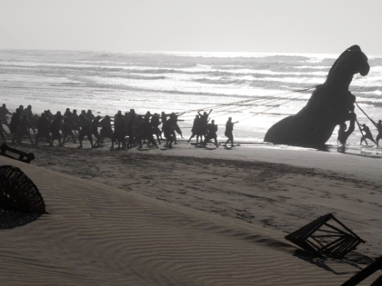 Film crew members pull a giant Trojan Horse prop from the Atlantic Ocean onto a beach during the filming of Christopher Nolan’s The Odyssey at Dakhla in occupied Western Sahara.