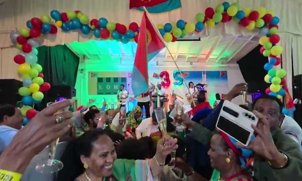 Eritrean diaspora celebrating in a community hall.