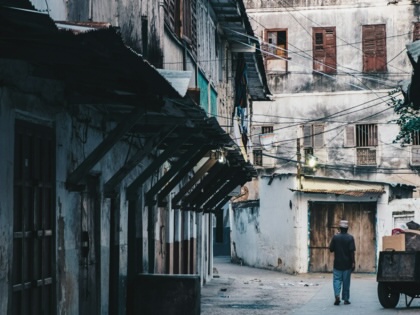 Man walking in the streets of Stone Town, Zanzibar.