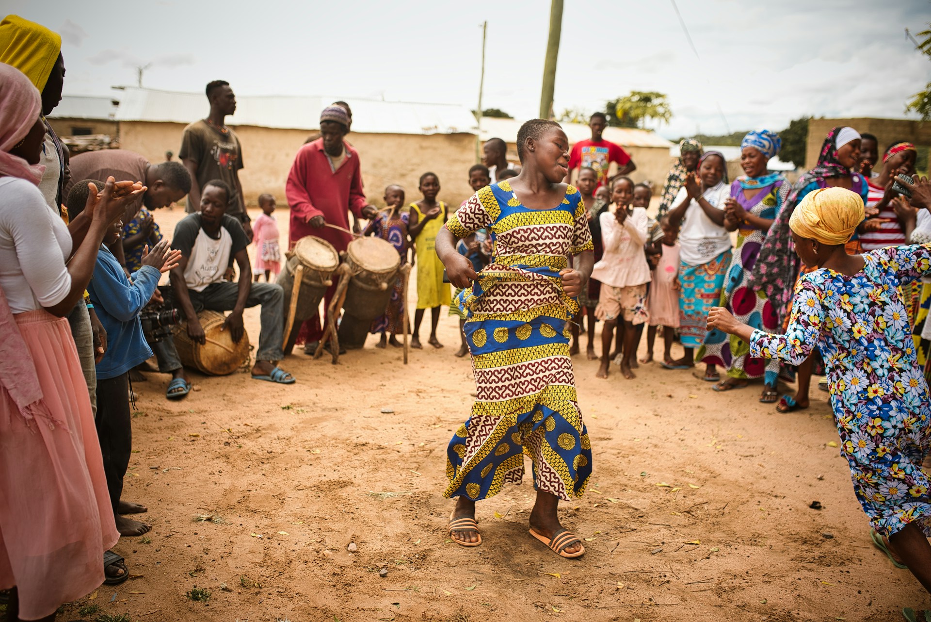 Woman dancing to traditional music in Ghana.
